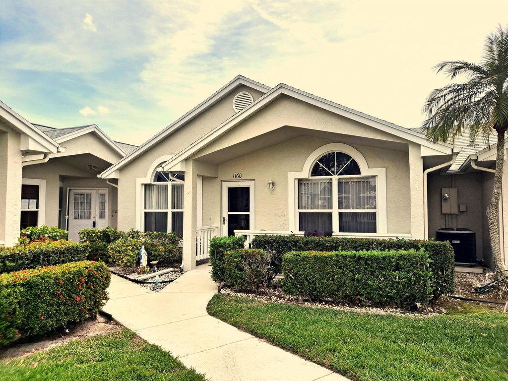 Photo of 1160 NW Lombardy Drive, Port Saint Lucie, FL 34986 (MLS # R10964479)