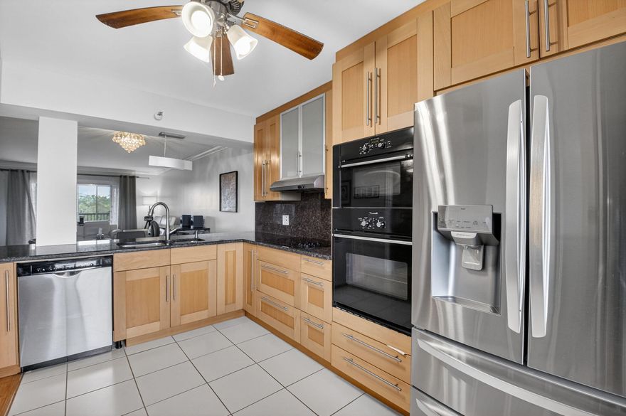 This beautifully renovated & highly sought after Buckingham model is ideally located in the 55+ community of Huntington Lakes, this stunning unit offers a spacious open floor plan designed for both comfort & style. The updated kitchen is a true highlight, featuring natural wood shaker-style cabinetry, granite countertops & backsplash, stainless steel appliances, & a double oven-perfect for everyday living & entertaining alike. The primary suite serves as a private retreat, complete with a cozy sitting area, large closet, beautifully renovated bathroom & direct access to the balcony for peaceful relaxation. The 2nd bedroom features its own en-suite bathroom, making it an ideal space for guests. Throughout the home you'll find gorgeous bamboo flooring in the living areas and bedrooms adding warmth and elegance. A convenient laundry room with a new full-sized front-loading washer and dryer completes this well-appointed residence. The kitchen and patio boast tile flooring. Enjoy the perfect blend of modern upgrades and comfortable living in one of the area's most desirable active adult communities. Beyond the walls of this exquisite condo, residents can enjoy access to a wealth of resort-style amenities designed to enhance their lifestyle. 610 seat theater, 350 seat banquet room, multiple card rooms, billiard room, aerobic and weight rooms, indoor pool, 9 pickle ball, courts, 4 Har tru tennis courts, 3 paddle tennis courts, bocce ball,  and clubs galore. The property is just minutes from Downtown Delray, shopping and dining along Atlantic Avenue, and the area's pristine beaches. Don't miss your opportunity to own a piece of paradise! Section 1 is a fabulous section to live in with a great private clubhouse for many social and private events. Salt water pool and jacuzzi at your back door.