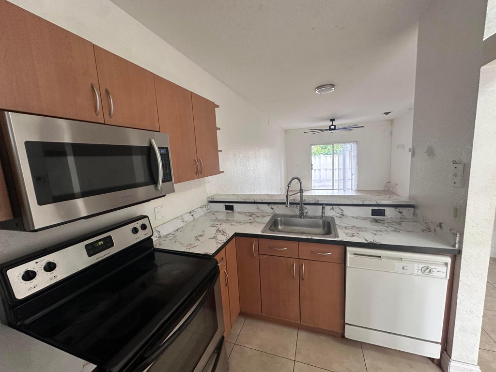 Photo of 3590 NW 91ST Lane #3590, Sunrise, FL 33351 (MLS # B26062715)