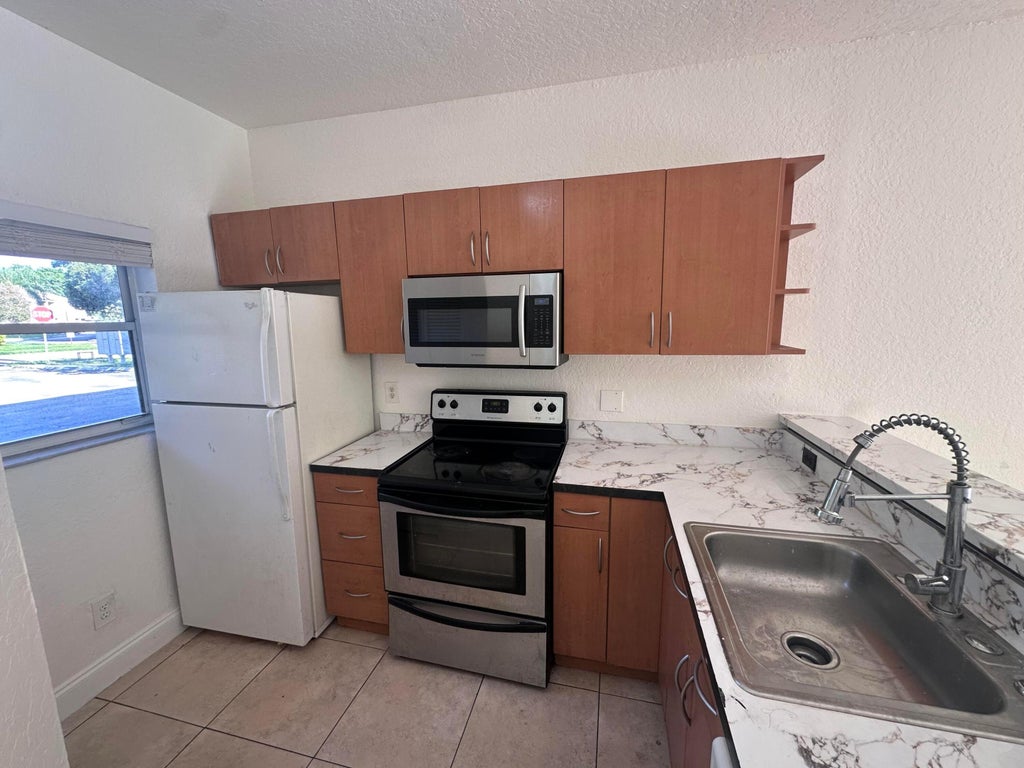Photo of 3590 NW 91ST Lane #3590, Sunrise, FL 33351 (MLS # B26062715)
