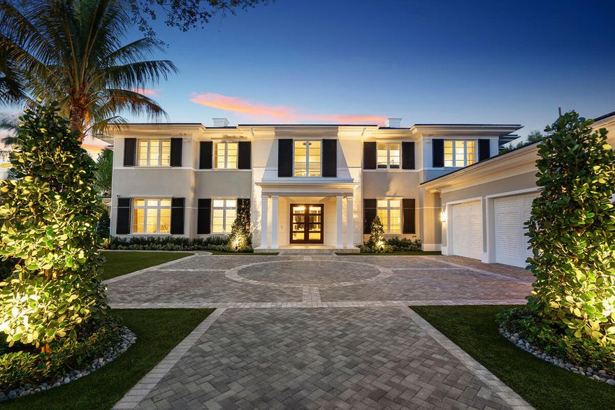 Set along 158 feet of the Butterfly Palm Waterway, 133 Coconut Palm Road is a waterfront estate by Wietsma Lippolis Construction, quietly positioned within Royal Palm Yacht & Country Club. Spanning over 8,400 square feet, the residence unfolds through a grand, open layout designed for both scale and ease of living. The main level transitions seamlessly from formal living and dining spaces to a well-appointed gourmet kitchen and family room, complemented by a club room with bar and wine cellar, a private library, and a flexible guest suite or fitness space. Upstairs, a secondary living area creates a natural sense of separation, accompanied by four en-suite bedrooms and a private primary suite with dual baths and dressing rooms, all oriented to capture calm, uninterrupted water views. Outdoors, a series of covered and open-air spaces frame the waterfront setting, where a summer kitchen, fire feature, and resort-style pool with spa are positioned to take full advantage of the home's expansive frontage. Originally constructed with a high level of finish and specification, the home presents a rare opportunity to secure scale, quality, and a refined waterfront lifestyle within one of the community's most established settings.