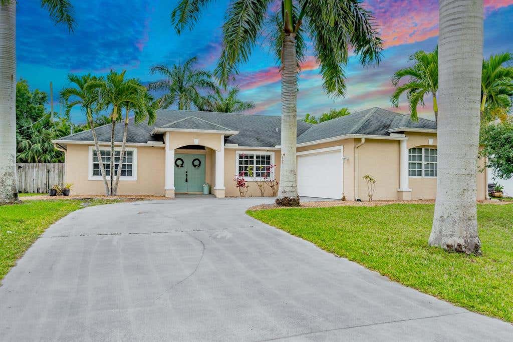 Photo of 1014 SW Eureka Avenue, Port Saint Lucie, FL 34953 (MLS # R10713166)