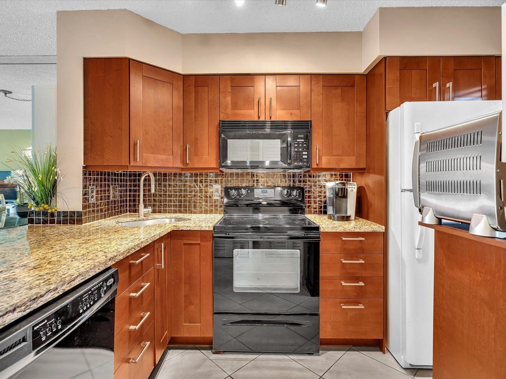 Photo of 2236 N Cypress Bend Drive #107, Pompano Beach, FL 33069 (MLS # F10550298)