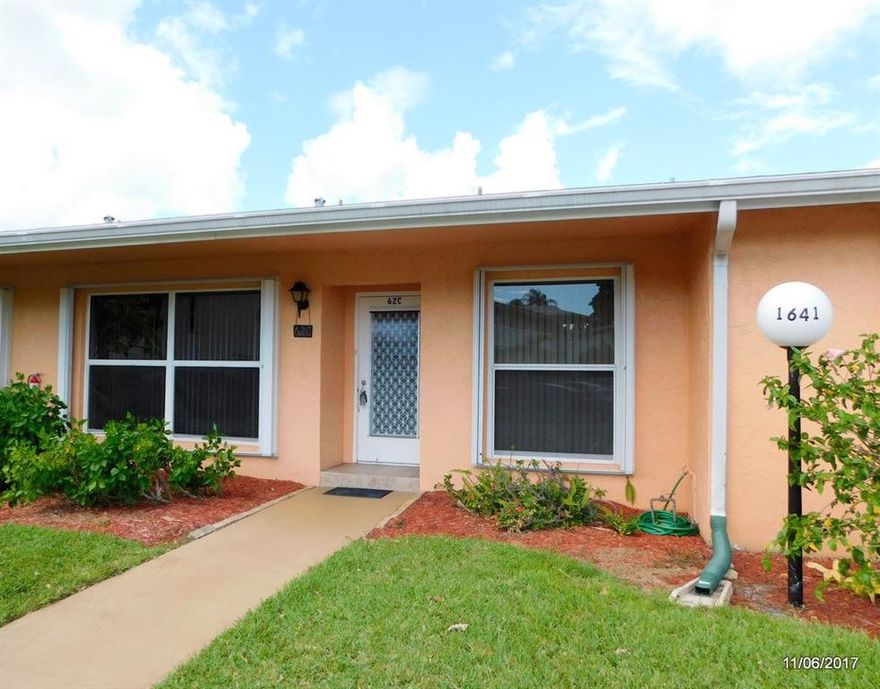 PRICE REDUCED  for quick sale!  Remodeled kitchen and guest bath.  Newer appliances, tankless water heater.  Lots of additional storage.  HUGE Florida room makes condo feel like a home.  Needs paint, carpet and wallpaper removal.  Located on quiet cul-de-sac.  Active community offers clubs, social activities, pools, tennis, gym, sauna & spa.  Guard gated 24/7.  Great place for the young at heart to live,  play & make new friends!  Short drive to beach, shopping & medical. Motivated seller. ACT TODAY!