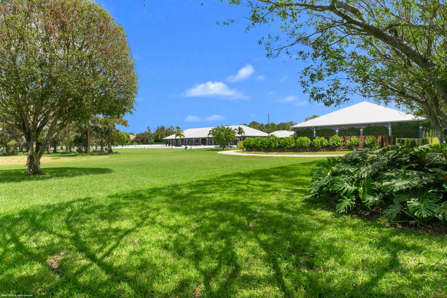 This incredible farm in White Fences was built in 2016 with no expenses spared. Sprawling over almost 11 beautifully manicured acres, this farm features two barns, a covered arena, serenity garden, plenty of grooms housing and a large storage building just to name a few. The serene landscaping creates a wonderful environment to train and care for your horses. The outdoor regulation dressage arena, the covered arena and the round pen, all feature RISO systems to create optimal footing regardless of the weather. The center aisle main barn has 16 Rower & Rub Bamboo stalls, all with automatic waterers, commercial fans in each stall and a fly spray system. The well designed, central grooming area has 4 wash/grooming stalls, a veterinary and a farrier area, all with easy access to the tack room The North house, also built in 2016 has 4 bedrooms, 2 bathrooms with convenient access to the main barn for the grooms. The separate storage building houses a salt water treadmill, equipped with a water treatment system and UV lights. In addition, the storage building has 2 mini split AC systems to enable temperature-controlled storage of hay/shavings or any extra equipment. The main barn and North house are hooked up to a generator to ensure no interruptions even during a power outage. The South barn and house were built in 1997 and have a separate entrance to allow for a separate operation. The barn has 8 Loddon stalls, also featuring automatic waterers, commercial fans and fly spray system. Both barns were built with concrete based stalls, all covered by rubber mats to prevent rodent intrusion and ensure the highest comfort for the horses. The South house has 2 bedrooms, 2 bathrooms and a bonus loft area upstairs. The screened in patio overlooks the lush covered arena. Nicely groomed bridle paths lead you from each barn and meets at the covered arena where you can watch the horses train in two raised viewing areas protected by an electric roll down screen for the sunny Florida days, all while listening to your favorite music through the built in sound system. The property has total of 11 paddocks that have been raised with proper drainage underneath to ensure horses can be turned out even during the rainy summer months. The entire property is covered by a camera system for everyone's safety. This property has too many features to mention, schedule a private tour today. 

DISCLAIMER: All information provided to you regarding this Property by Realtor and her associates has been obtained from third parties such as the Multiple Listing Service, public records and other sources. All Buyers should independently verify all information provided regarding this Property. The Sellers, Realtor and Broker make no representation as to the accuracy of this information. All Buyers should perform their own independent due diligence regarding this Property before executing a Contract for Sale and Purchase for this Property.