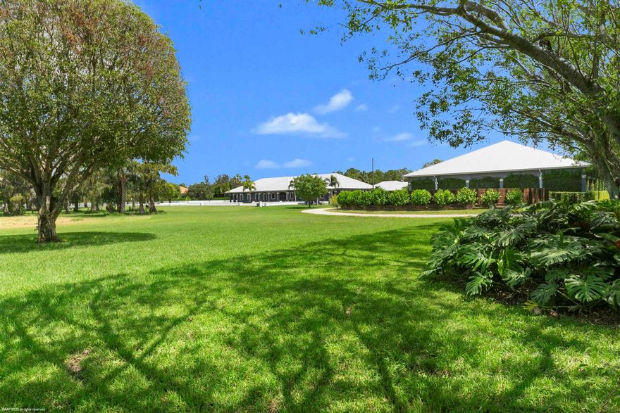 This incredible farm in White Fences was built in 2016 with no expenses spared. Sprawling over almost 11 beautifully manicured acres, this farm features two barns, a covered arena, serenity garden, plenty of grooms housing and a large storage building just to name a few. The serene landscaping creates a wonderful environment to train and care for your horses. The outdoor regulation dressage arena, the covered arena and the round pen, all feature RISO systems to create optimal footing regardless of the weather. The center aisle main barn has 16 Rower & Rub Bamboo stalls, all with automatic waterers, commercial fans in each stall and a fly spray system. The well designed, central grooming area has 4 wash/grooming stalls, a veterinary and a farrier area, all with easy access to the tack room