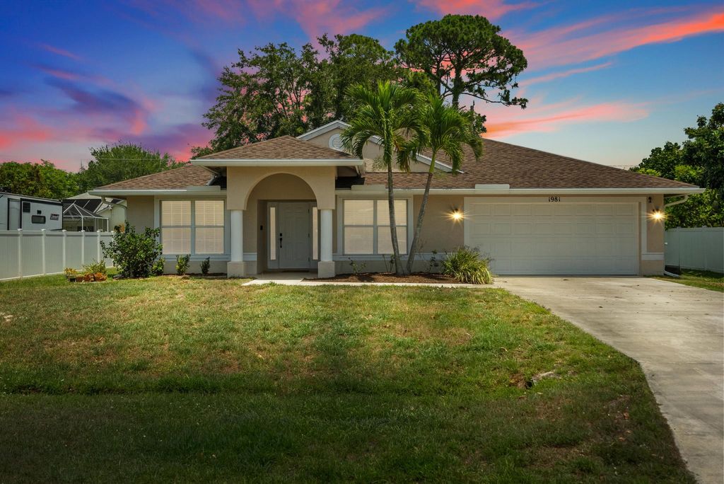 Photo of 1981 SW Delmonico Avenue, Port Saint Lucie, FL 34953 (MLS # R10991200)