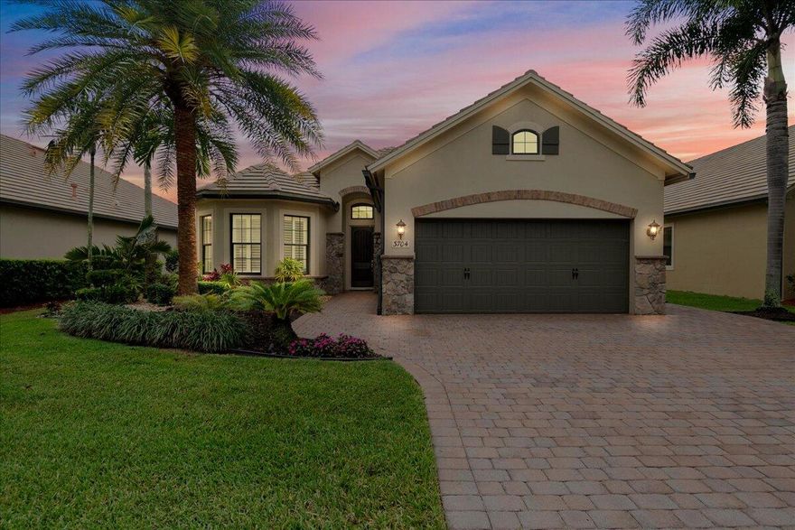 IMPACT DOORS & WINDOWS ON ORDER.  This beautifully upgraded home offers a perfect blend of style, functionality, and modern convenience. When entering the home, you cannot miss the dramatic high ceiling and the elegant plank tile flooring continued throughout the main living areas. Step into the gathering room and delight in the welcoming lake view straight ahead!  The sliding glass doors open fully and pocket to enjoy the indoor/outdoor living this home provides. The home's layout is enhanced by custom touches, including wood beams and built-in shelving in the office/den, crown molding, as well as custom closets throughout for exceptional storage. The primary bathroom has been completely remodeled with thoughtful design and  high-end finishes while the guest bath kept its footprint but was refreshed with new shower door, shower floor, fixtures and lighting. Enjoy Florida living outdoors with an extended patio with built-in grill, quartz countertop, remote phantom screens, and a fully fenced backyard. Imagine beginning and ending each day enjoying the water view and temperate weather. The extensive landscaping and outdoor lighting provide great curb appeal and evening ambiance. Hobbyists will be excited to see the garage, which includes a workbench and lots of cabinets for tools or other supplies. Additionally, the garage has an extended depth, and the driveway has been widened to accommodate additional parking when necessary. The Castellina community provides a gated and manned entry, clubhouse with fitness center, heated pool, tennis courts and pickleball. The quarterly fee also includes lawn maintenance and sprinkler care. This home has been meticulously maintained and thoughtfully enhanced- truly move in ready and designed for comfortable Florida living. The best homes are the ones that stay relevant no matter what season of life you are in. Here, there's room to settle in, stretch out, and make new memories along the way. Whatever the future brings, this home offers a strong and welcoming foundation for every chapter still ahead.
