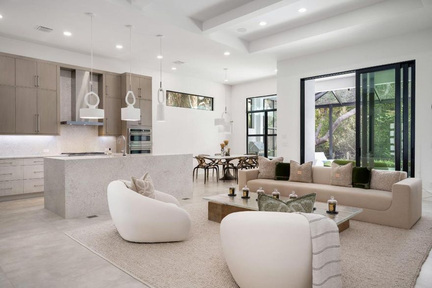 Brand new in 2024 and thoughtfully curated to the highest standard, this exceptional villa embodies elevated coastal living with an unmistakable sense of organic luxury. Designed by acclaimed local firm Piarulli Collective, the residence showcases the finest finishes and additional $208k in custom upgrades.
The light-filled interior offers three bedrooms and two-and-a-half baths, highlighted by expansive large-format tile flooring, Venetian plaster walls, and custom California Closets. The designer kitchen makes a striking statement with quartz countertops, sophisticated tuxedo cabinetry, GE Café appliances, undermount lighting, and refined architectural detail. Spa-inspired baths feature floor-to-ceiling tile, LED mirrors, floating cabinets, and an expansive primary bath with a generous walk-in shower appointed with dual rain shower heads. Impact windows and doors, Lutron automated shades, enhanced whole-house EERO WiFi, Sonos throughout indoor and outdoor, and a whole-house and pool Generac generator provide modern comfort, security, and peace of mind.
Outdoor living is equally impressive with upgraded panoramic pool screening, travertine pavers, and three elegant deck jets, creating a private resort-style setting ideal for relaxing or entertaining. This is a rare opportunity to own a brand-new, professionally designed villa where no detail has been overlooked and every upgrade has been thoughtfully selected.