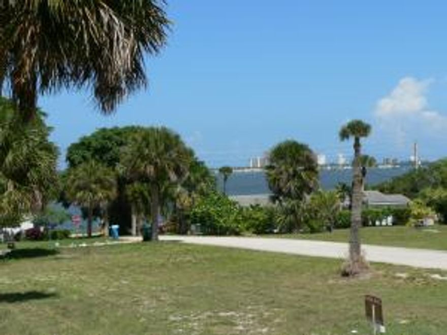 Jensen Beach. High elevation lot with partial wide water views. Property includes ownership interest in dock at end of Spring Hill drive and one
mooring slip. Slip has pilings ready for lift. Adjacent lot is also available. Address number is estimated. It is 2nd lot uphill of 102 Spring Hill