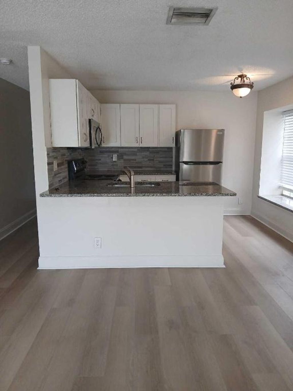 Photo of 2634 W 28th Street, Riviera Beach, FL 33404 (MLS # R11154778)