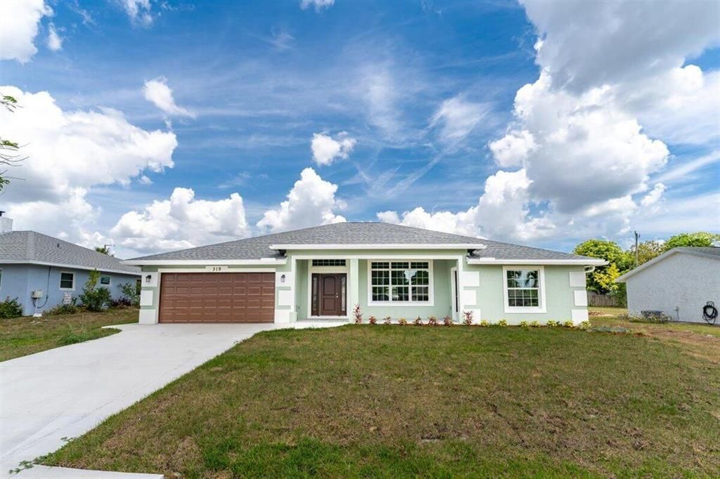 Photo of 319 NE Surfside Avenue, Port Saint Lucie, FL 34983 (MLS # R10795871)