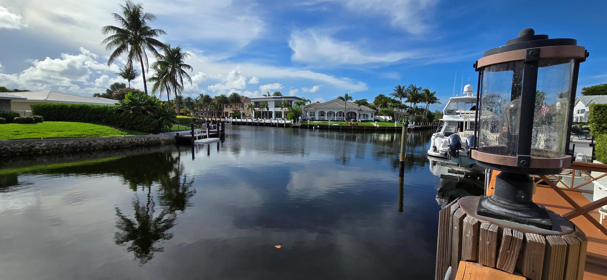 Amazing water views! No fixed bridges! Bring the boat! Beautiful intracoastal home, pool, jacuzzi & dock! Great location close to restaurants, shops & beach! Gorgeous beamed cathedral ceilings, spacious & open floorplan. Remodeled kitchen, granite counters, island, eat in area, stainless appliances, Subzero refrigerator & Thermador double oven. Built in pantry cabinets for ample storage. Butler kitchen & versatile office. Brick fireplace living room, formal dining & buffet area. Family room w long waterfall counter bar. All overlooking the pool & intracoastal! Master bedroom offers walk in closet plus sunroom w closet & water views. Master bath walkin shower & spa tub. IMPACT windows & auto roll down screens. Exceptional waterfront outdoor living space, pool, jacuzzi, extended deck & dock