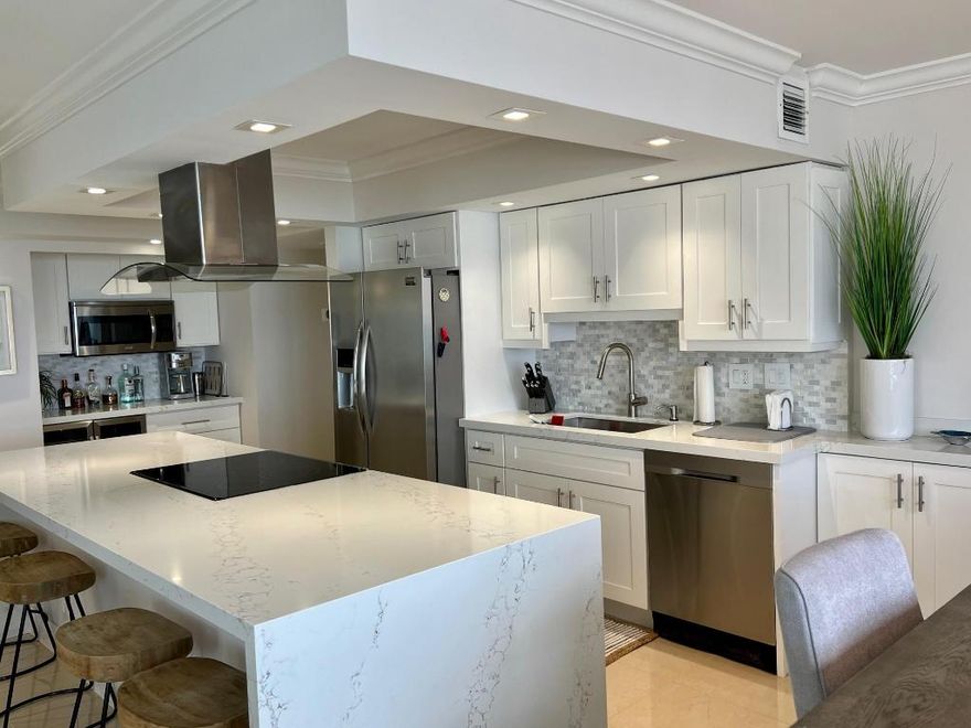 Spectacular fully updated DIRECT OCEAN South East corner unit with wrap around terraces. Enjoy the ocean views as well as the sunsets to the West. Clear tempered glass balcony allows unobstructed views of the ocean. Professionally designed and decorated. Impact hurricane glass windows with remote control window treatments. Washer/dryer in the unit. Ready for the 2025-2026 winter season! 3 Month minimum.