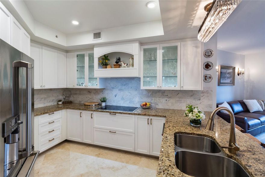 Owner Relocating!  Large price reduction.  Won't last long.  Enjoy gorgeous Beach and Intracoastal views from rooftop pool and fitness center. This large corner 2 bedroom, 2 bathroom condo with Marble floors throughout with an open floorplan. Remodeled Kitchen with custom cabinets, upgraded stainless appliances and built ins. Newer AC and Impact windows & doors. 2 garage parking spaces with 24 hour security.  Pet Friendly building, allowing 2 Dogs any size! Luxury building built in 2008 with only 61 units. Great location.  Walk to Beach, great restaurants, new Publix shopping and just minutes to Las Olas and Fort Lauderdale Airport. A must see. Owner Relocating!  Large price reduction.  Won't last long.  Enjoy gorgeous Beach and Intracoastal views from rooftop pool and fitness center. This large corner 2 bedroom, 2 bathroom condo with Marble floors throughout with an open floorplan. Remodeled Kitchen with custom cabinets, upgraded stainless appliances and built ins. Newer AC and Impact windows & doors. 2 garage parking spaces with 24 hour security.  Pet Friendly building, allowing 2 Dogs any size! Luxury building built in 2008 with only 61 units. Great location.  Walk to Beach, great restaurants, new Publix shopping and just minutes to Las Olas and Fort Lauderdale Airport. A must see.  Will not last long.