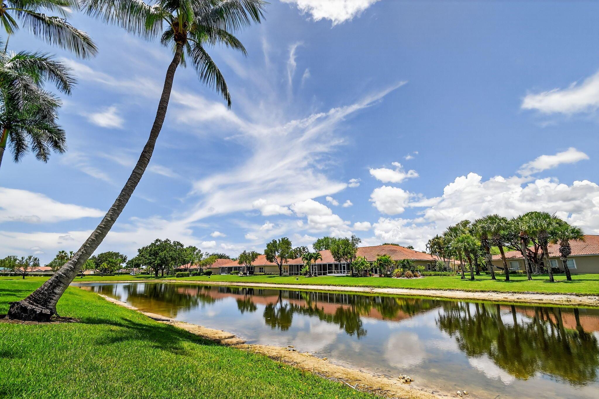 You found your home! Step into this bright and airy coach home, with views of the water from the glass enclosed Florida room. The kitchen is cheerful and light filled with white cabinetry with a large pantry. Living area is very spacious and versatile. Primary bedroom is large with a walk-in closet. The ensuite bath features a large garden tub and separate shower. The community boost a non membership clubhouse with plenty of activities, 3 pools, tennis, pickleball courts , fitness center, many clubs and more. All nestled in a lovely park-like setting. All close to shopping ,entertainment, restaurants and more. See it today! Enjoy the great Florida lifestyle!