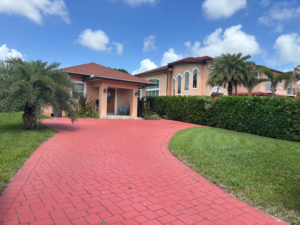 Photo of 4649 Lillian Avenue #A, Palm Beach Gardens, FL 33418 (MLS # B26011102)