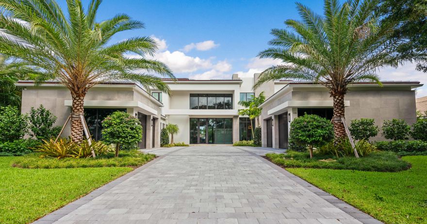 Nestled along the oak canopied street of Quayside in Admirals Cove lies this furnished, contemporary, new construction home ready for occupancy. Built by one of the area's top custom home builders, Hasey Construction made sure they paid incredible attention to every detail in this new masterpiece. From the moment you arrive, you will know that this custom waterfront residence is different from others you have seen in your lifetime.  The approach is elegant and timeless featuring storefront impact windows and doors, smooth concrete accents and solid wood garage doors. As you enter the foyer of this luxury estate, you'll find natural stone flooring throughout the main living areas, a wood veneered see-through gas fireplace perfectly situated between the formal living and family room... impeccable ceiling details, and a wall of glass along the back of the home which brings the outside, inside.  Off the family room you'll find a gourmet kitchen suitable for a culinary chef.  Precision mitered porcelain countertops, Sub Zero & Wolf appliances, fine milled cabinetry and designer plumbing fixtures. Downstairs you will find the master suite along with an enormous waterfront club room and an in-law suite.  

The oversized master suite is definitely fit for a king & queen with water and pool views, tremendous natural light, drapery pockets and closets that will be hard to fill, even for the most accomplished shopper.  Her master bath will not disappoint featuring white marble floors, free-standing contemporary tub, frameless glass shower, beautiful quartz vanity top, custom cabinetry and an elegant dressing area.  His bath is more masculine in appearance, but the fit and finish is second to none.  

This custom home is equipped with an elevator, but when you see the craftsmanship of the floating staircase, you may never want to ride.  Solid wood treads ensconced in glass and polished metal, the stairs in this custom home are the perfect combination of art and functionality.

Upstairs, both family members and guests will live in the lap of luxury.  Featuring an oversized loft, 3 ample guest bedrooms with ensuite baths, walk-in closets, large balconies and water views galore. 

If your ship has come in, this is where you will want to keep it. With 110ft of waterfront, a new custom dock will be the main feature outdoors.  The dock will have a lounging deck for entertaining, water, electric and room for up to a 80ft yacht.  Relax poolside in your custom heated pool and spa featuring automated controls, waterfalls and a sun shelf for splashing about.  Can you smell those tomahawk ribeyes cooking on the grill?  The outdoor living area provides for a well-appointed summer kitchen, ample room for outdoor furnishings and phantom roll down screens for added comfort.  This is the custom home of your dreams and you can have it now!