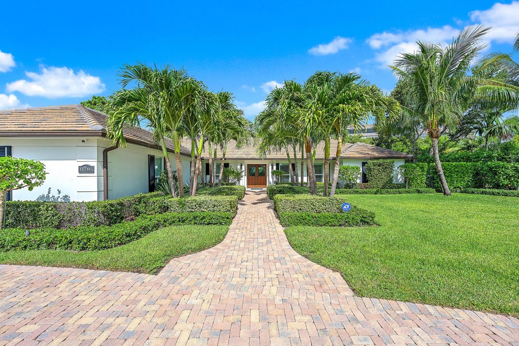 Photo of 11785 Lake Shore Place, North Palm Beach, FL 33408 (MLS # B26060103)