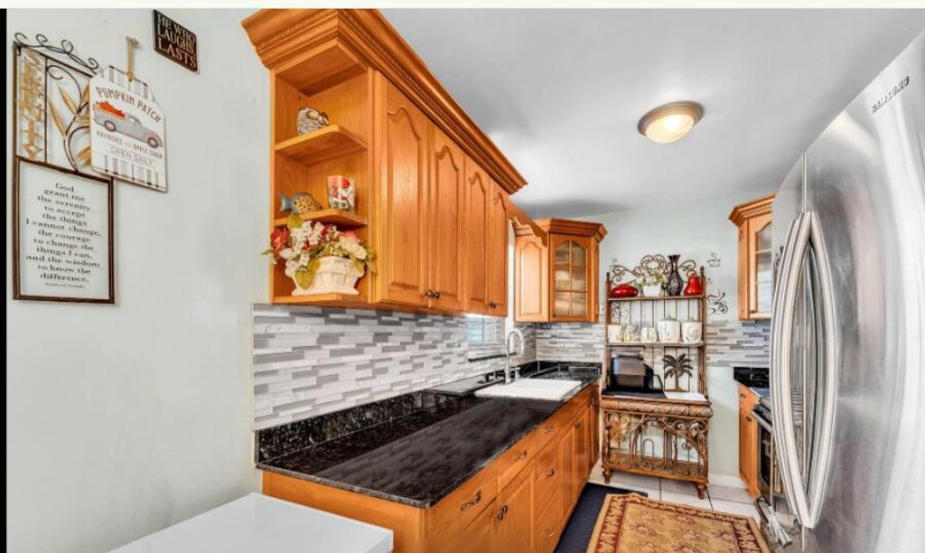 Photo of 848 SE 3rd St, Belle Glade, FL 33430 (MLS # B26000504)