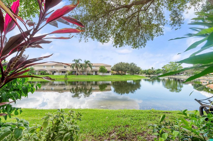 Welcome Home! 2b/2b & 1/2 bath updated townhome corner lot unit on the lake. With a beautifully updated & spacious kitchen that includes NEW appliances, upgraded light fixtures and wood floors throughout the unit and more. A bright combination of dining & living room with the kitchen featuring a breakfast area, pantry, & snack counter! Two large master suites upstairs each providing full bathrooms, spacious upgraded walk-in closets with lake view. Washer & Dryer In Unit! First floor features storage area under the stairs, as well as a utility closet on the patio. Family friendly neighborhood, close to the Sawgrass Expwy, Sawgrass Mills Mall, Publix, restaurants and downtown Tamarac. With 2x assigned parking spots (#3-1) right in front unit. Pets under 30lb ok.