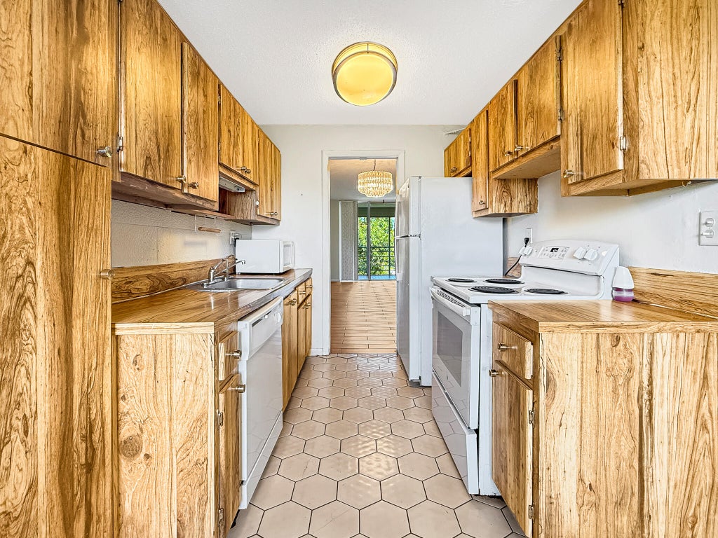 Photo of 3070 NW 48TH Terrace #414, Lauderdale Lakes, FL 33313 (MLS # B26074233)
