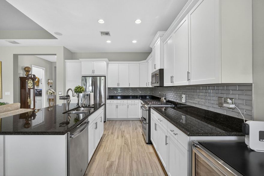 $15K Buyer Credit with Preferred Lender + Freshly Painted Interior! Welcome to your WATER VIEW (no rear neighbors ever), MOVE-IN READY versatile 3-bedroom (3rd room currently used as a dining room), 2-bath layout offering excellent flexibility. The 3rd room easily converts into a bedroom, with a built-out closet requiring only doors and tracks to complete. This impeccably maintained and tastefully upgraded home is located in the highly sought-after Hammocks community of Westlake. Step inside to a bright, open and airy lake view with wood-inspired tile flooring throughout. The open-concept floor plan centers around a chef's kitchen featuring a gas range, GE appliances, granite countertops, glass subway backsplash, stainless steel appliances, and an expansive island ideal for entertaining. The primary suite is a true retreat with a spa-inspired bath, dual vanities, oversized glass-enclosed shower, and generous walk-in closet. Enjoy seamless indoor-outdoor living on the screened, covered patio  perfect for relaxing or hosting  complete with a mounted 32" TV. The expansive backyard offers ample space for a future pool, garden, or play area.

Residents of The Hammocks at Westlake enjoy resort-style amenities including a clubhouse, resort pool, splash pad, fitness center, playgrounds, and more, plus convenient access to shopping, dining, and major commuter routes. This move-in ready home offers elevated finishes, functional design, and exceptional community living. Don't miss this opportunity  schedule your private showing today.