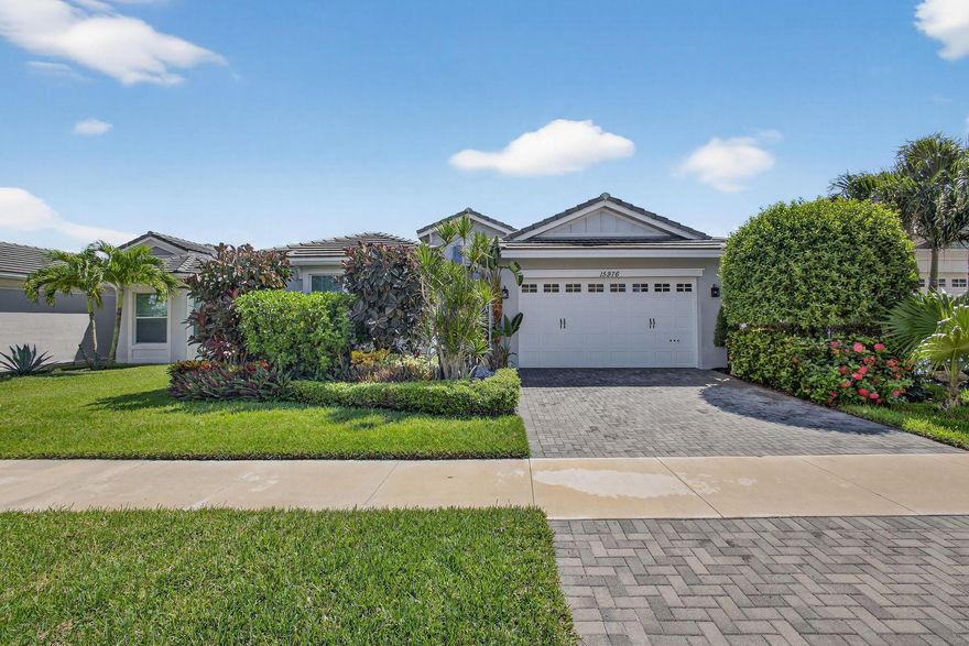 Welcome to your WATER VIEW (with no rear neighbors ever),  MOVE IN READY versatile 3-bedroom (3rd room currently being used as a dining room) 2-bathroom layout offering exceptional flexibility. The 3rd room is easily converted into a bedroom, the closet is built out, requiring only doors and tracks to complete the transformation. This impeccably maintained and tastefully upgraded residence located in the highly sought-after Hammocks community of Westlake.Step inside and be greeted by a bright, open and airy lake view, on wood-inspired tile flooring that offers the timeless appeal of hardwood with the durability and ease of tile.
