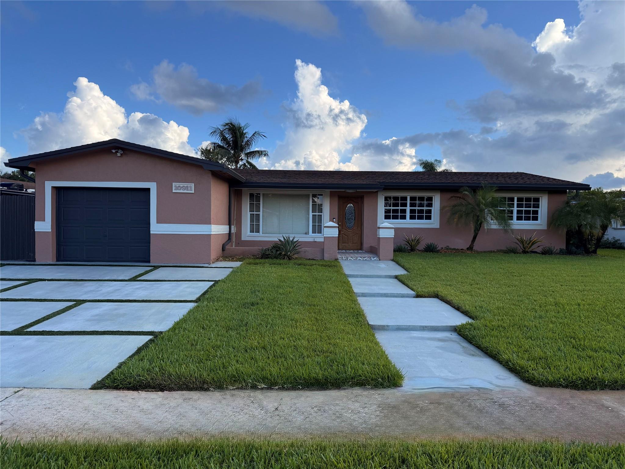 Step into this stunning single-family home located in the highly sought-after community of Pembroke Lakes. Perfectly situated in a family-oriented neighborhood, this 4-bedroom, 2-bathroom residence offers comfort, style, and convenience. The beautifully updated kitchen features granite countertops, while the modernized bathrooms add a touch of luxury. Cozy up by the electric fireplace in the spacious living area. Step outside to your very own private backyard oasis — complete with a renovated pool patio, outdoor kitchen, and a separate grilling area — ideal for entertaining or relaxing year-round. Located in an A-rated school district and just minutes from shopping, dining, and entertainment. Showings by appointment only – don’t miss out on this exceptional home!