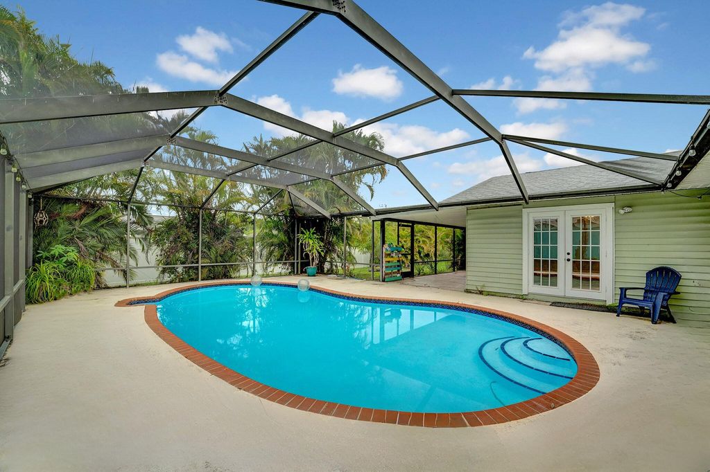 Photo of 1918 SE Cheltenham Street, Port Saint Lucie, FL 34983 (MLS # B26008196)