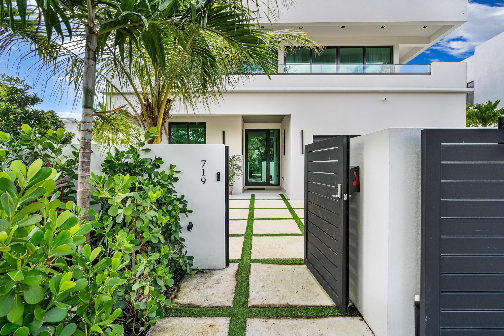 Experience elevated living in this private, gated 4 bed / 4.5 bath estate just steps from Las Olas. Custom built with over 3,700 sq ft, this fully furnished home is turnkey and stocked with everything you need from kitchenware to luxury linens. Surrounded by lush landscaping, the property features an infinity saltwater pool, heated spa with waterfall, alfresco dining with outdoor kitchen, and a true tropical ambiance. Inside, enjoy JennAir appliances, a butler’s pantry, impact windows, automatic shades, and a spa-style primary suite with soaking tub and oversized shower. This smart home offers full control of lights, security, AC, and more—plus cameras and full privacy. Walk to shops, restaurants, Holiday Park’s pickleball and tennis courts, dog park, and live shows at Parker Playhouse.