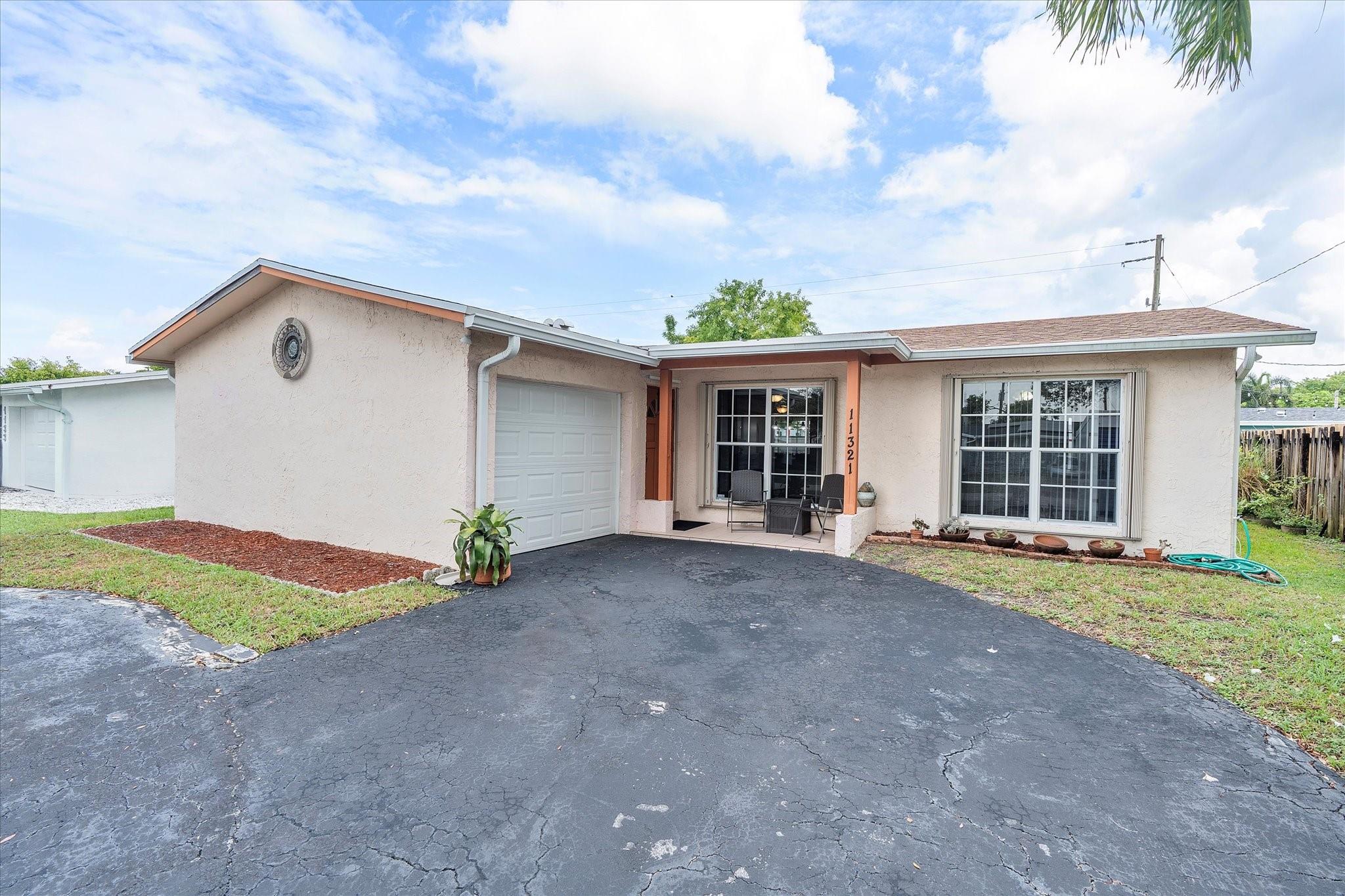 Located in the heart of Sunrise, this spacious 3 Bedroom 2 Bathroom home is just what you've been searching for! Here you'll be in close to many parks, schools, shopping, dining, and entertainment. The home features a 2021 roof, split floor plan, and a Florida room. Your Primary Bedroom is separated from the other bedrooms and offers an ensuite bathroom. In the kitchen there are beautiful solid wood cabinets, granite counters, granite backsplash, and stainless steel appliances. You'll love entertaining on the screened patio or out in the back yard.