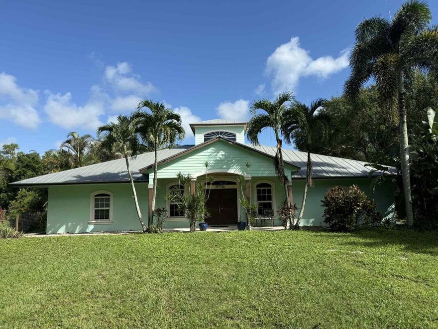 Rare 5 Bedroom Split Floor Plan in Jupiter Farms 1.25 Acre corner with oversized 30x26 detached garage, 39x48--4 Bay Shop Building Perfect for business owners or just needing warehouse space without renting commercial buildings Mechanics or car collectors dream Amazing amount of space if needed Great Floor Plan with great functionality & flow Gather w/friends & family-plenty of space to spare One Bedroom can be an In-law suite/office or private room that has it's own entry and full bath. Pool is a fully heated Swim Spa-in an amazing outside oasis, Bring your toys—room for boat/RV, trailers and more! Enjoy sunrise coffee on the covered patio, watch the stars at night, and live the Jupiter Farms lifestyle with no HOA. Minutes to I-95/Turnpike, Riverbend Park and Jupiter beache