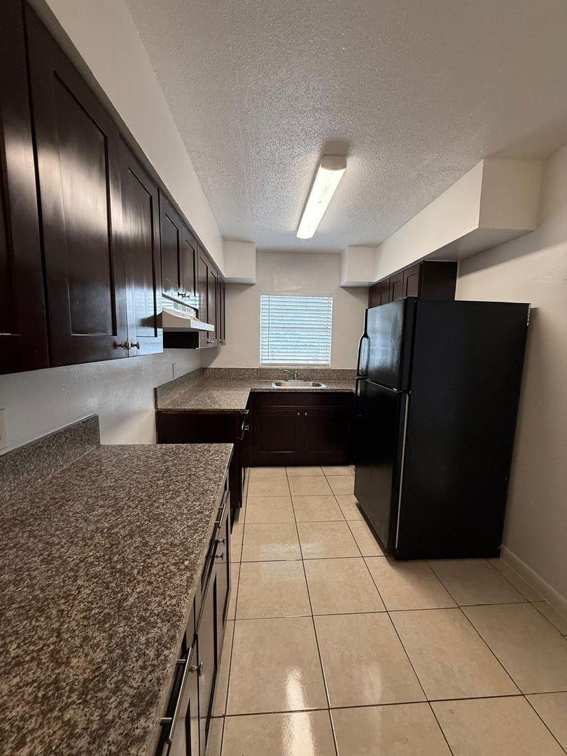 Welcome to this lovely ground floor 3 bedroom, 2 bathroom apartment located in Coral Springs, Florida 33065. This is a fully renovated upgraded apt with new tile floors, new kitchen cabinets and bathroom. The kitchen is fully equipped with a refrigerator and stove.