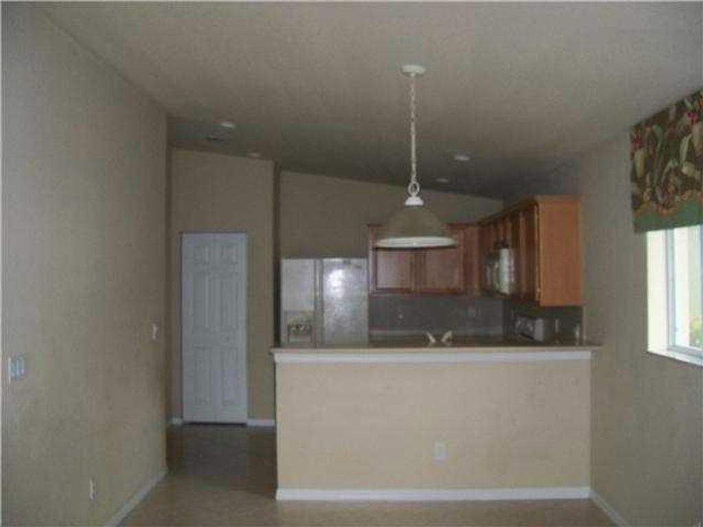 Photo of 1887 SW Newport Isles Boulevard, Port Saint Lucie, FL 34953 (MLS # R11101710)