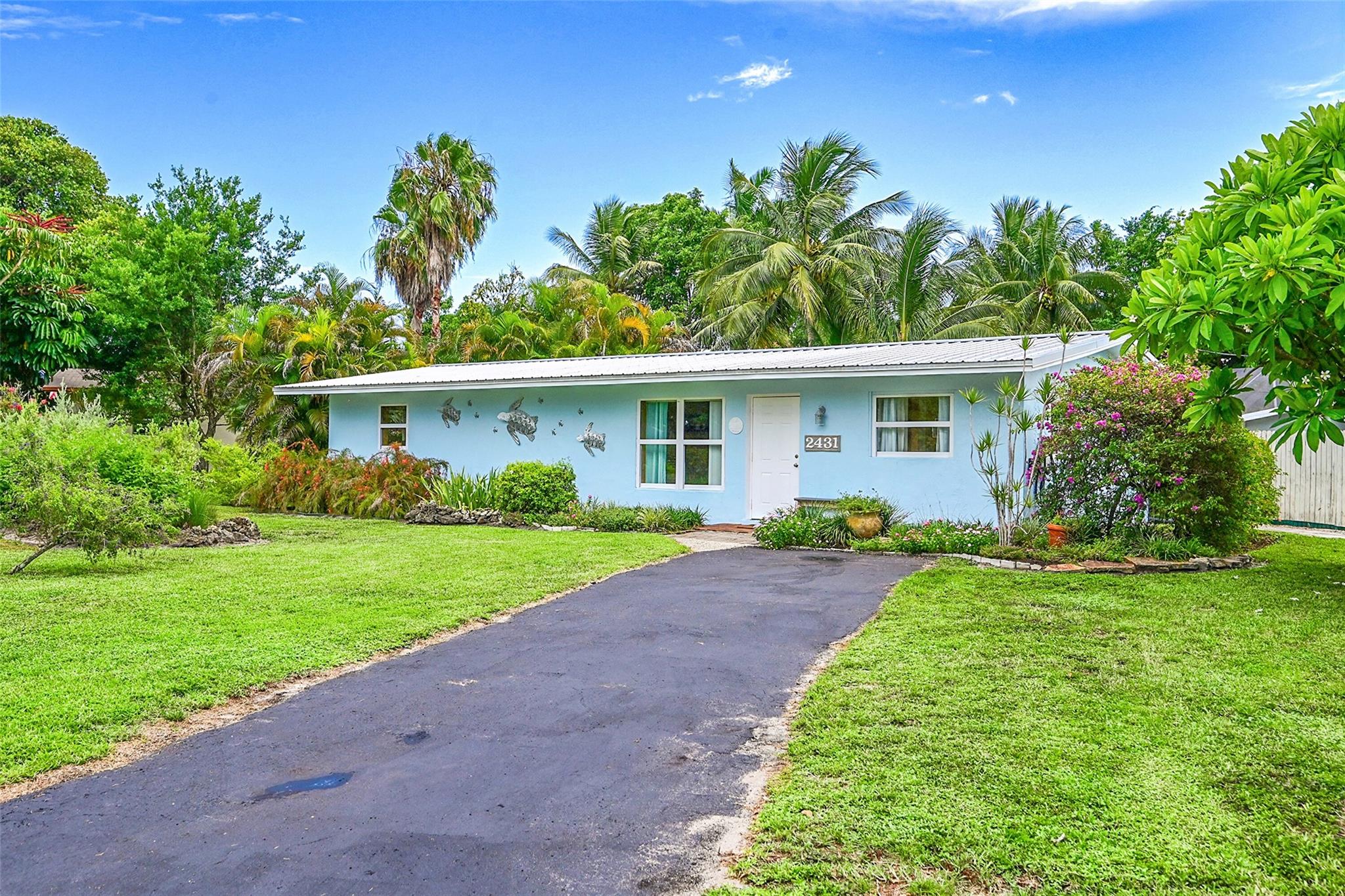 BRING YOUR FHA AND VA BUYERS. This 3/2 Completely renovated home is located in a desirable neighborhood, this impeccably maintained home offers a fantastic opportunity for homeowners or investors. Featuring a 2019 metal roof, 2019 water heater, and 2024 A/C, the home is both energy-efficient and move-in ready. Inside, enjoy luxury vinyl flooring throughout and a stunning brand-new kitchen with sleek finishes and SS appliances. A stylish laundry room adds convenience, while the inviting yard features a relaxing hot tub—perfect for entertaining. FULL IMPACT windows offer added security and efficiency. Ideal as a primary residence, rental, or Airbnb, this home is the perfect mix of comfort, style, and investment potential. NO HOA. Great for FHA or VA loans. EV Ready!