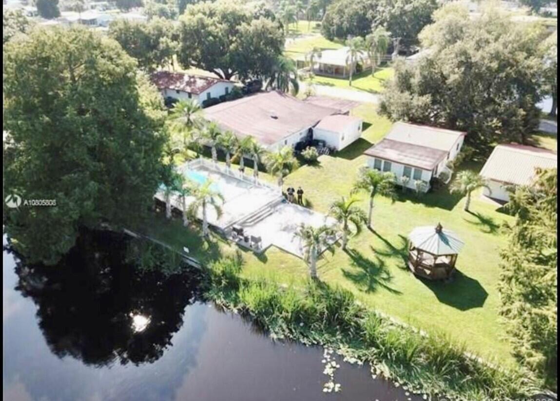 READY TO MOVE- IN ! Beautiful 2 bedroom /1 bathroom villa in the heart of Okeechobee. Very conveniently located ,close to shopping, restaurants, beaches and more.....Just minutes away from the Historical Lake Okeechobee This property boasts a private front yard and a large backyard with a great canal view with boat docks. Property also has a private Pool and an on-site Laundry room.Rent includes Water and Lawn Care.NO HOA................ Available immediately!!