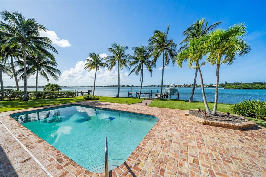 Rare point lot with endless views on the Loxahatchee River and an amazing 232' of BLUE WATER frontage.  Just under 1/2 acre lot in the heart of Jupiter gives opportunity to renovate/addition to current house or build your own dream house.  New seawall adds immediate value and peace of mind for new owners.  Dock and 12,000 lb lift in place and ready to go.