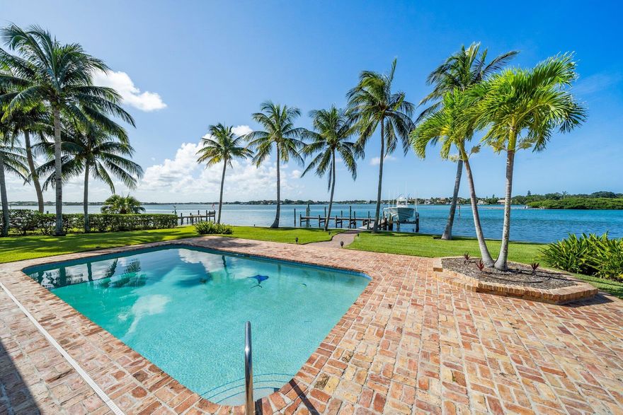 Rare point lot with endless views on the Loxahatchee River and an amazing 232' of BLUE WATER frontage.  Just under 1/2 acre lot in the heart of Jupiter gives opportunity to renovate/addition to current house or build your own dream house.  New seawall adds immediate value and peace of mind for new owners.  Dock and 12,000 lb lift in place and ready to go.