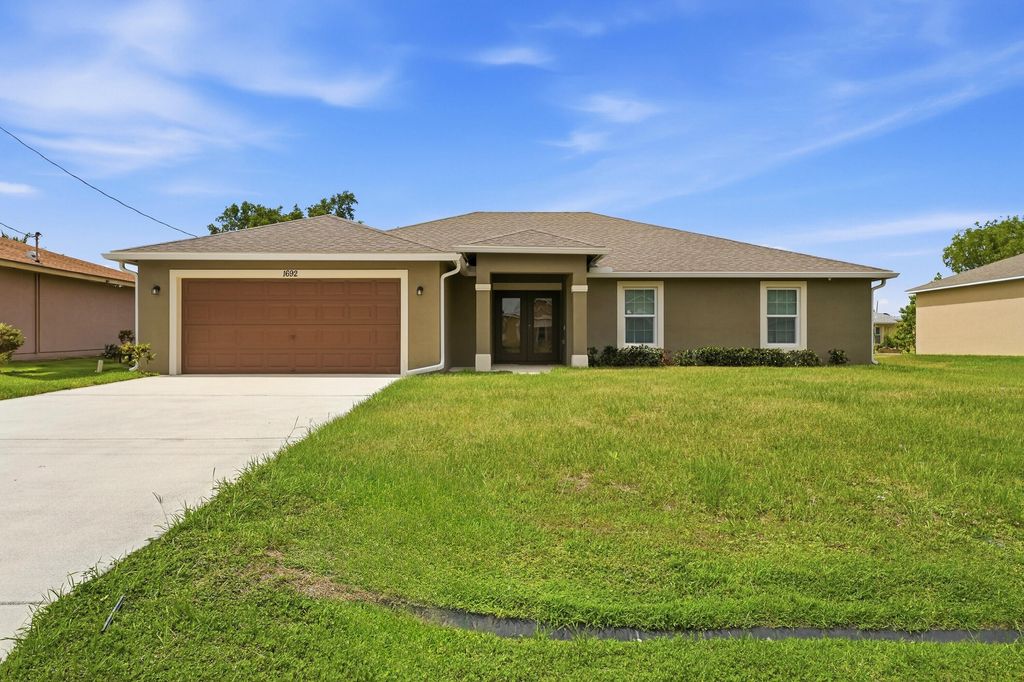 Photo of 1692 SW Alvaton Avenue, Port Saint Lucie, FL 34953 (MLS # B26032304)