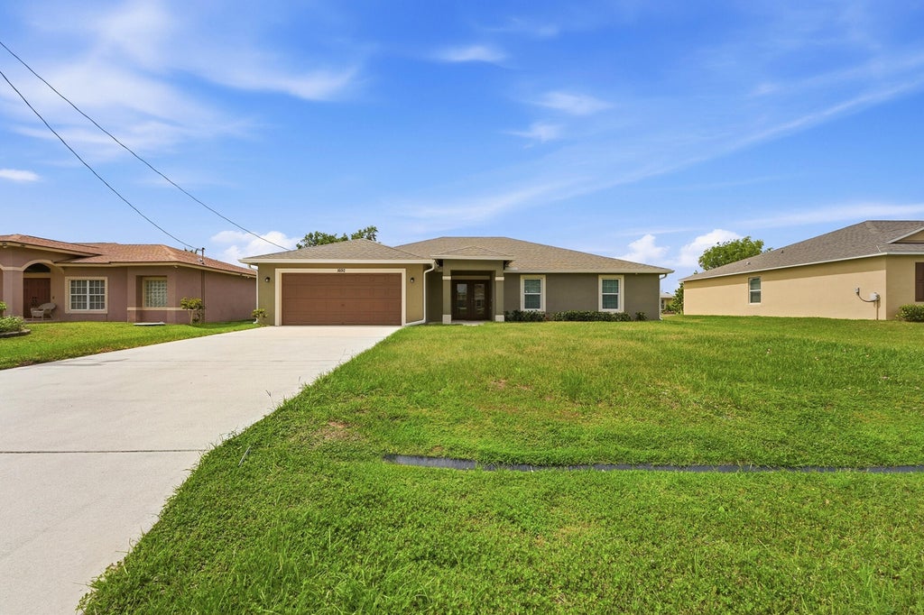 Photo of 1692 SW Alvaton Avenue, Port Saint Lucie, FL 34953 (MLS # B26032304)