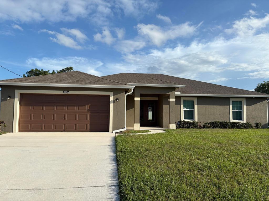 Photo of 1692 SW Alvaton Avenue, Port Saint Lucie, FL 34953 (MLS # B26032304)
