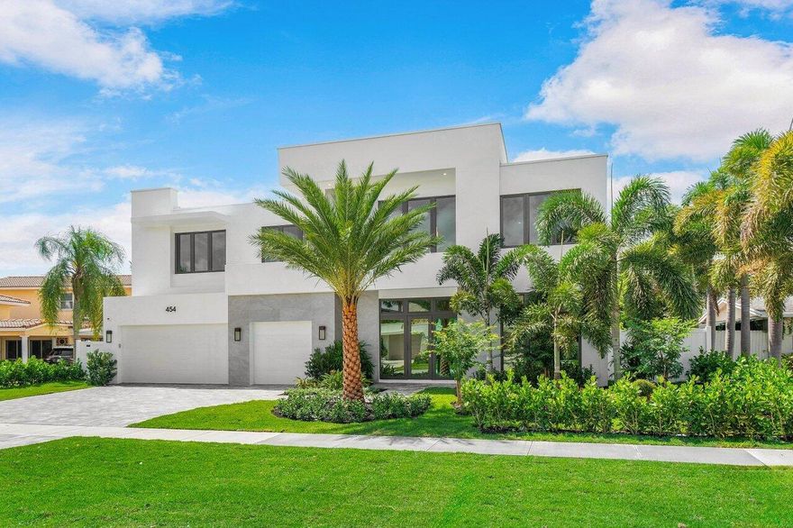 A tropical oasis! Brand New Construction in Boca Villas, just a short walk to Mizner Park's famous restaurants and shops, and Boca Raton's beautiful beaches. This contemporary Mizner Development two-story home, has 5 bedrooms and 5 and a half bathrooms, with a large club room on the main floor, and a spacious media loft upstairs. An open kitchen with Wolf and SubZero appliances, large dining area and open living spaces.  Primary suite features expansive closets, spa bath with wet area, and two water closets. Porcelain patio overlooking a heated sparkling pool, with overflow spa, fountains, and cabana with summer kitchen.  This one-of-a-kind outdoor oasis with tropical landscaping is the perfect spot for relaxing with family or entertaining guests. A standout Golden Triangle Home!