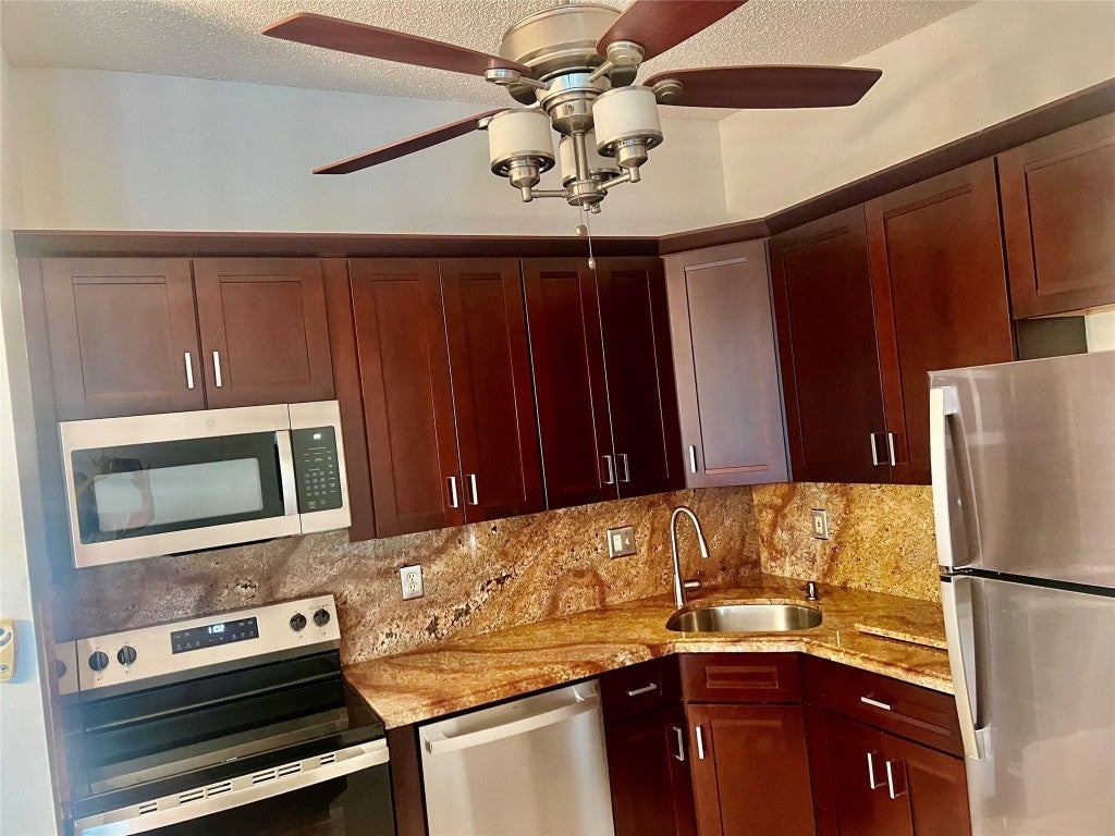 Photo of 9383 S Belfort Circle #209, Tamarac, FL 33321 (MLS # F10465293)