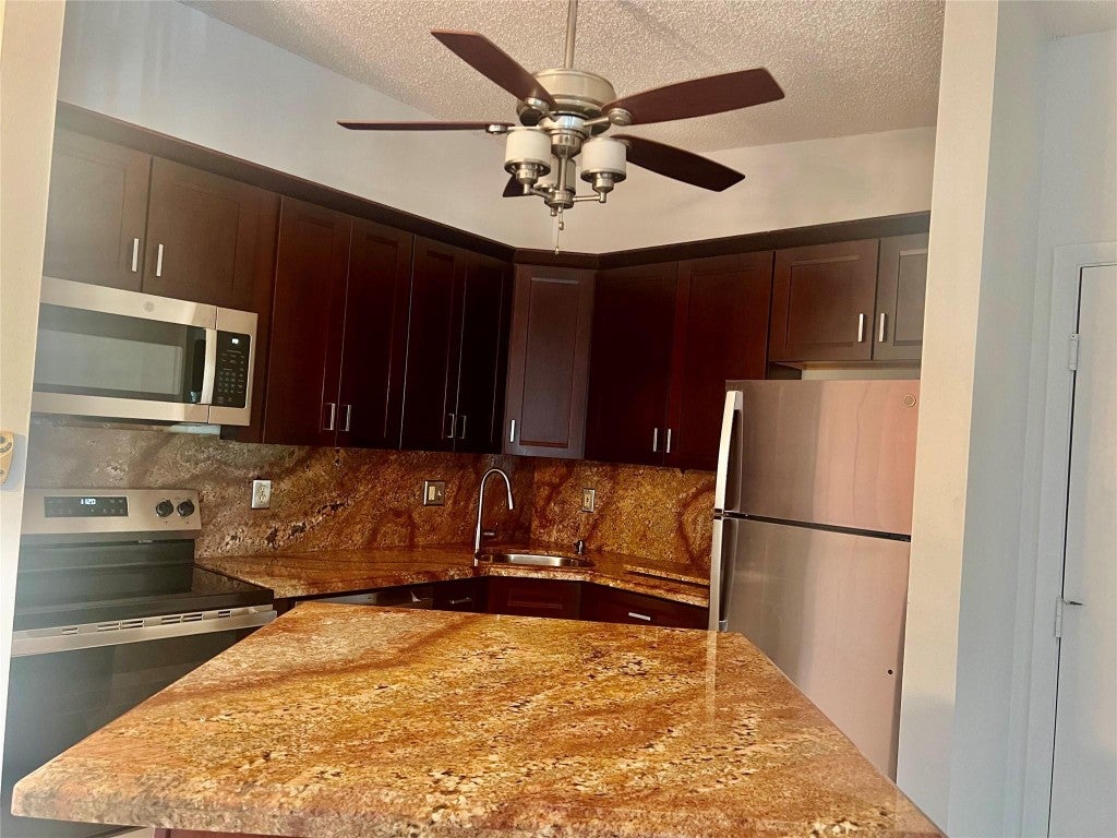 Photo of 9383 S Belfort Circle #209, Tamarac, FL 33321 (MLS # F10465293)