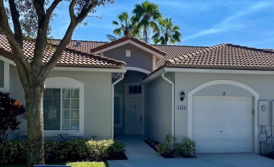 WOW- The home you have been waiting for! Your new home has an updated kitchen with expanded counter space and extra cabinets/storage. Both bathrooms have also been remodeled. Tile in the living areas with wood laminate in the bedrooms. Large screened patio, one car garage/w double driveway. New roof 2018- AC & water heater are 1 year old. Your resort style  community is  guard gated w/ 24 hour security, enjoy clubhouses, pools, tennis, gym, basketball and more. Your monthly fees include insurance, cable and internet, roof, lawn and use of all amenities. Private hot tub on patio can stay or be removed. Welcome home!!!