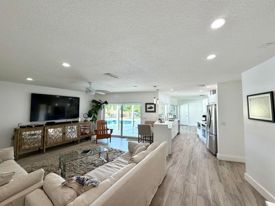 Welcome to this fully renovated, stunning Lakefront, home in coveted Palmetto Park Terrace- a private waterfront oasis, perfectly positioned on a quiet cul-de-sac lot in one of East Boca Raton's most desirable neighborhoods. This 4 Bedroom, 3-Bath single-family pool home offers open-concept living, with sweeping lake views from nearly every room. Step inside to a kitchen that flows seamlessly into the living, dining & family rooms, featuring modern white cabinetry, quartz countertops, & stainless-steel appliances. Entertain effortlessly with a Sonos outdoor sound system and expansive glass doors that open to the pool deck and serene lakefront