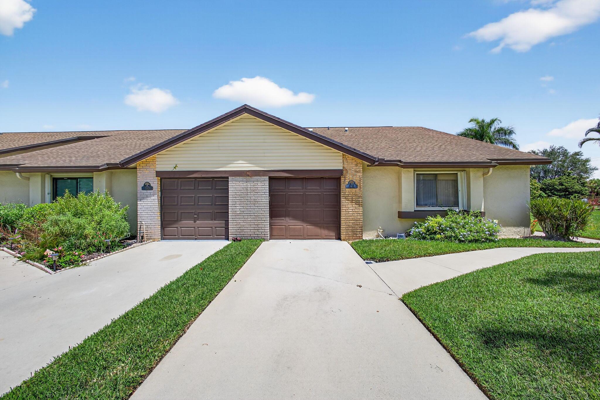 Wonderful corner Villa in the beautiful and quiet Village Walk Community (Royal Palm Beach), relax in your backyard with a lake view in this 3 bed, 2 bath Villa with updates. Lovely vaulted living room and family room allowing lots of natural light, kitchen and primary bathroom features newer cabinets & countertops, private laundry room, with plenty of storage space. Well maintained property in great condition, neat & clean. Community pool & hot tub to enjoy and relax. This great home is located just minutes away from fine shopping, dinning and much more: RPB Recreation Center, Veterans Park, Commons Park, and more!