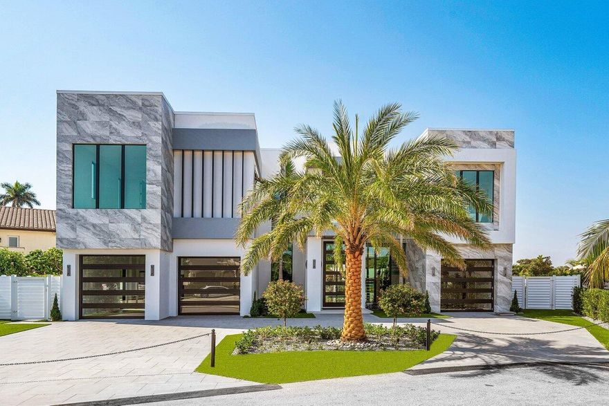 Brand new construction, completed in April of 2023 and nestled in one of South Florida's most prestigious waterfront communities, Sun & Surf—749 Bamboo Drive is a custom contemporary masterpiece that captivates you with its elegant simplicity and its modern design. The thoughtful layout includes 7,502 square feet of interior living space, with six bedrooms and eight bathrooms. The open, two-story layout flows with clean lines and an array of unique finishes and details. Premium, modern kitchen features Sub-Zero 72'' wide refrigerator, six burner Wolf gas range, dual Wolf wall ovens, a Ruvati 57'' two-tiered workstation, and a large walk-in pantry with second refrigerator. Interior highlights include 12' ceilings on the first floor, elevator with large window and touchscreen controls, impact glass throughout, four-zone air conditioning with linear diffusers, center-stringer style staircase with floating treads and glass rail, 20' wide sliding glass doors, club room with wet bar, primary suite with dual sitting areas, fully-recessed TV ceiling hinge by Future Automation that accommodates a 75" flat screen tv, large covered balcony with glass railing and a primary bath with zero-entry shower with full slab porcelain walls and oversized soaking tub.