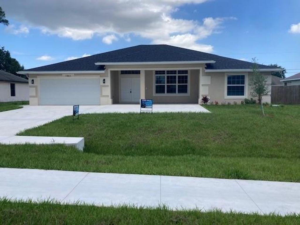 Photo of 1661 SW California Boulevard, Port Saint Lucie, FL 34953 (MLS # F10515525)